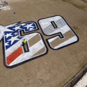 grass painting logo memorial motogp