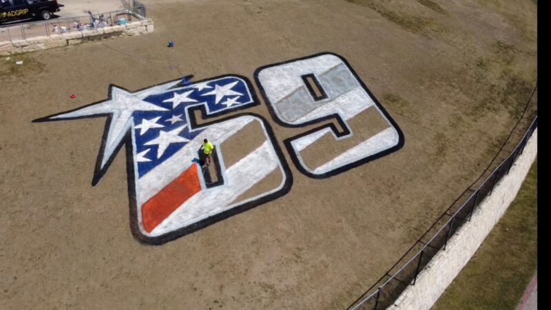 grass painting logo memorial motogp