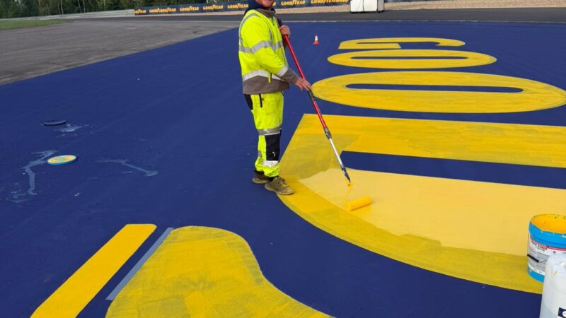 race track sponsor branding painting